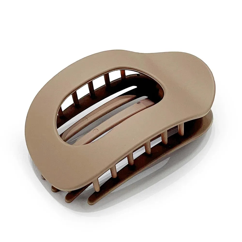 Beige hair clip on a white background