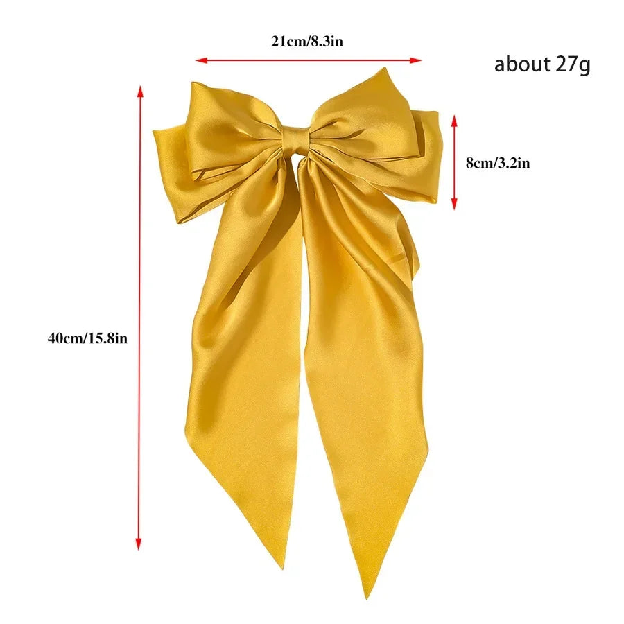 Yellow bow with measurements on a white background