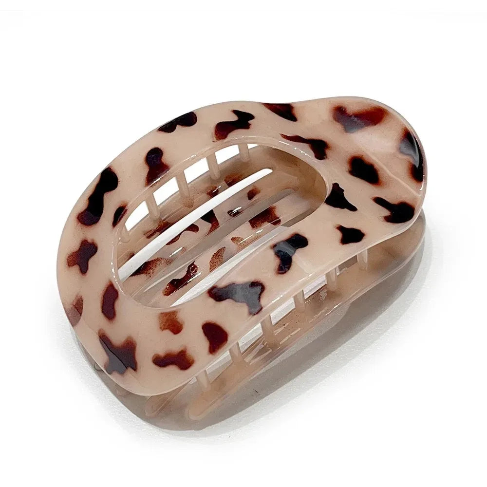 Leopard print hair clip on a white background