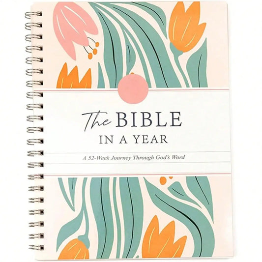 Notebook with floral design and 'The Bible in a Year' text on a white background