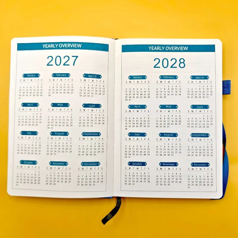 Open planner showing yearly calendars for 2027 and 2028 on a yellow background