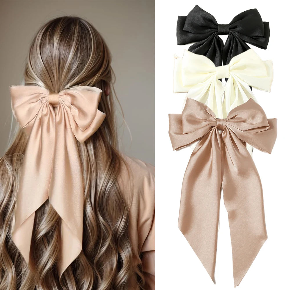 Hair bow accessory on a person with additional bows displayed on a white background.