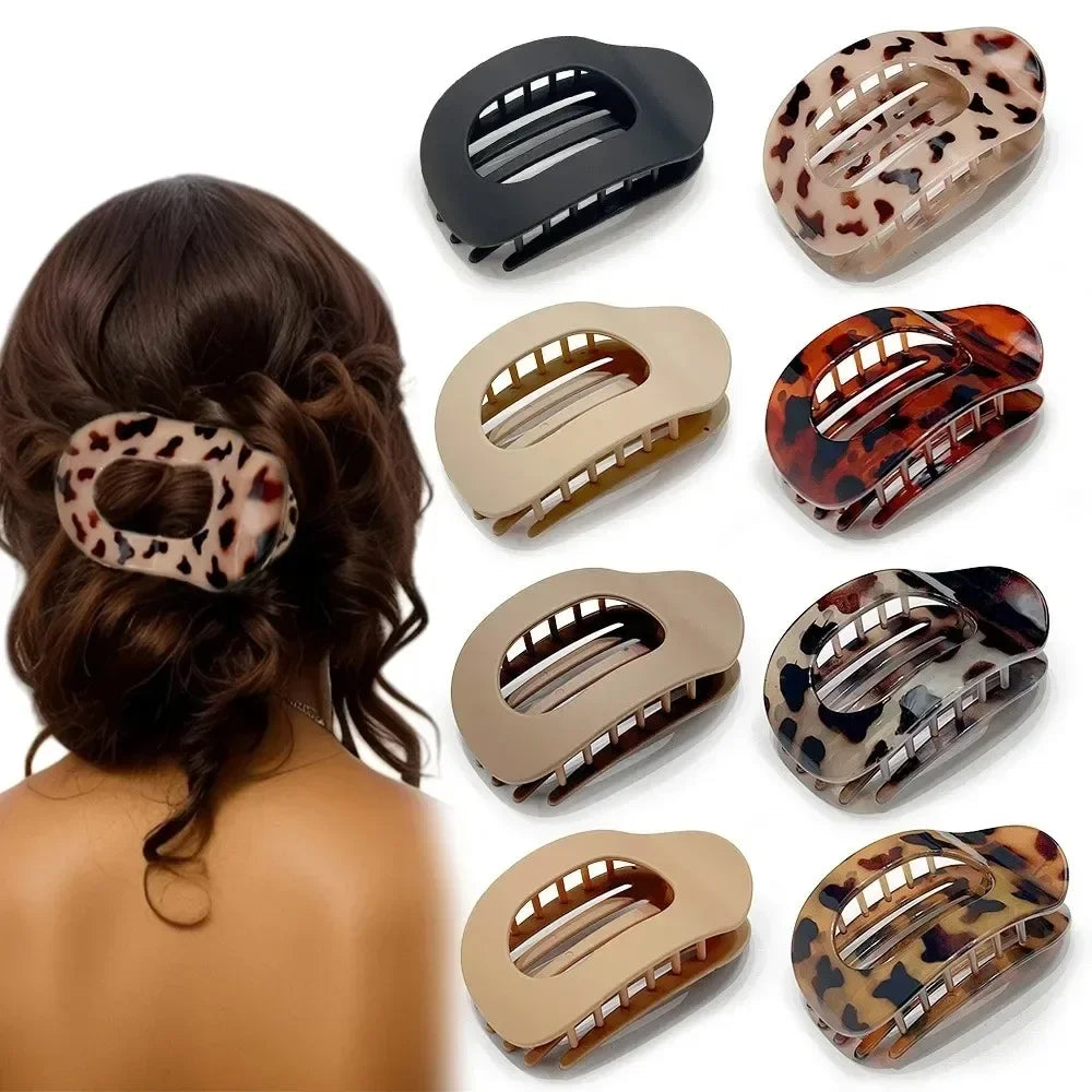 Set of hair clips with leopard print and solid colors on a white background
