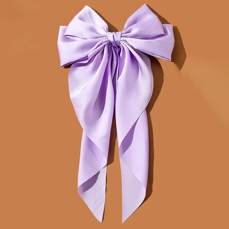 Lavender bow on a brown background