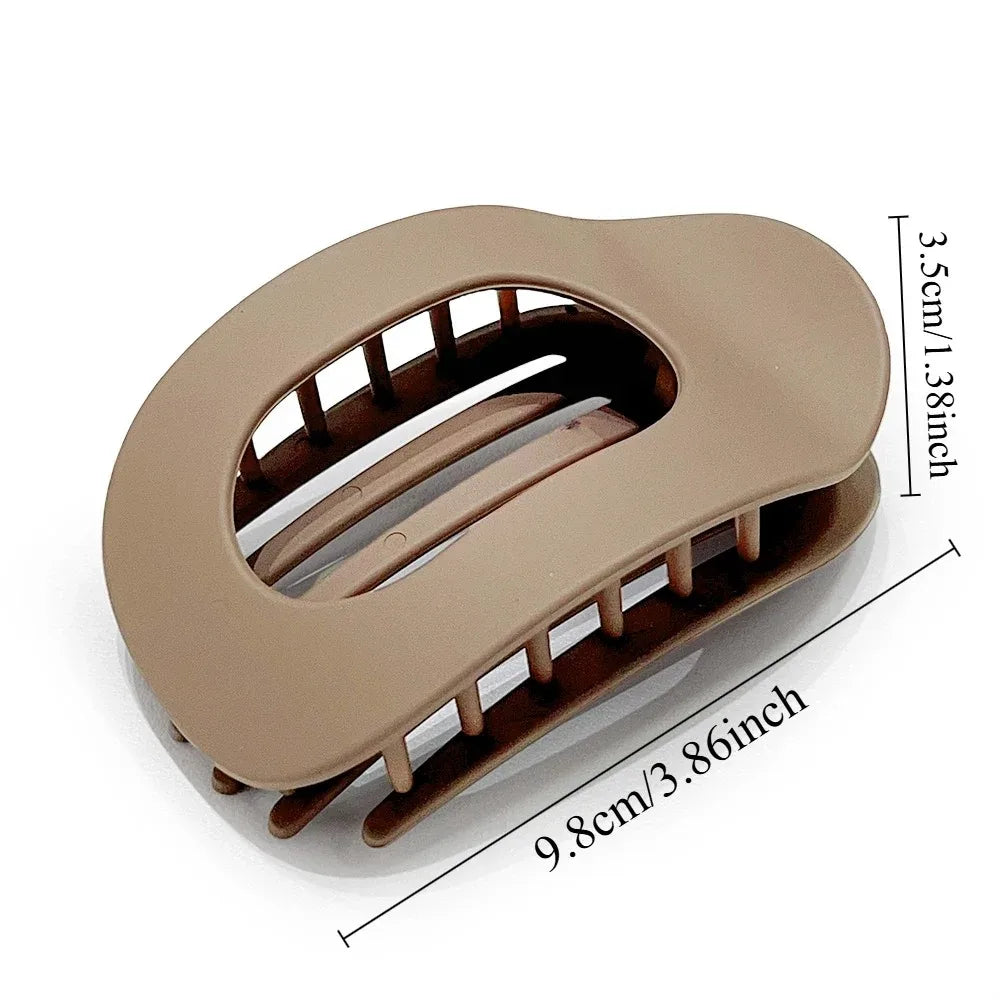 Beige hair clip with measurements on a white background