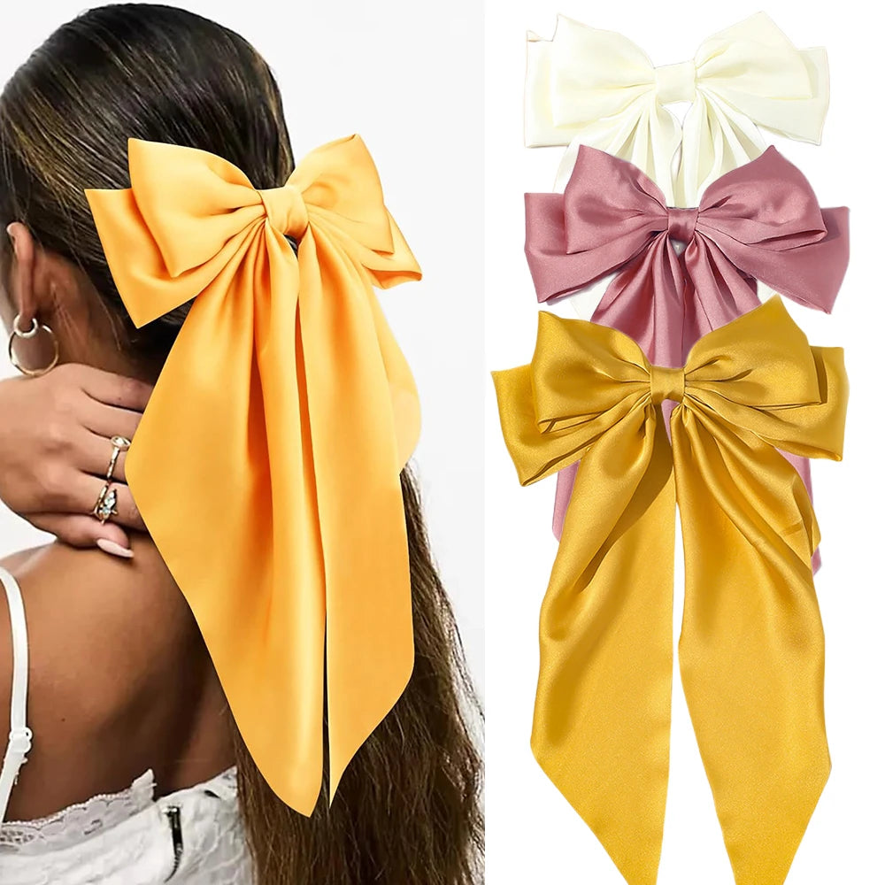 Yellow hair bow accessory with close-up of product on white background