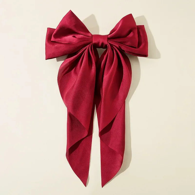 Red bow on a beige background